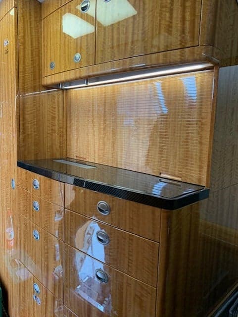 A close-up of the wooden cabinetry inside the aircraft.