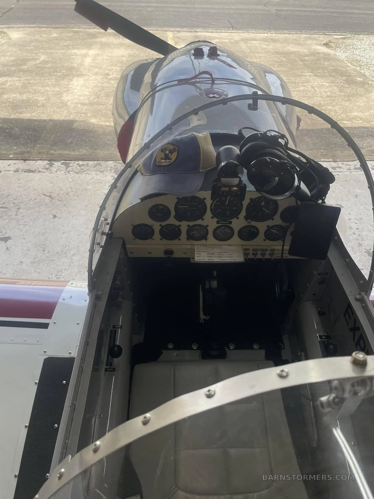An overhead view of the cockpit of an experimental aircraft, showing the instrument panel and controls.