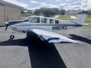 Side view of Beechcraft Bonanza N987KC on the ramp.