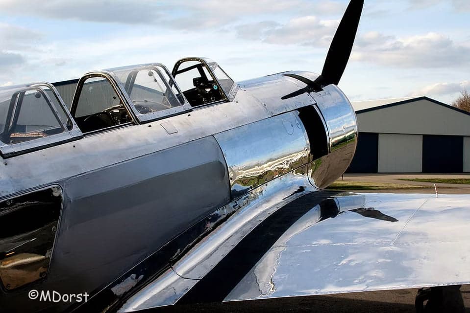 Rear quarter view of a polished aircraft with the tail number D-FMAX.