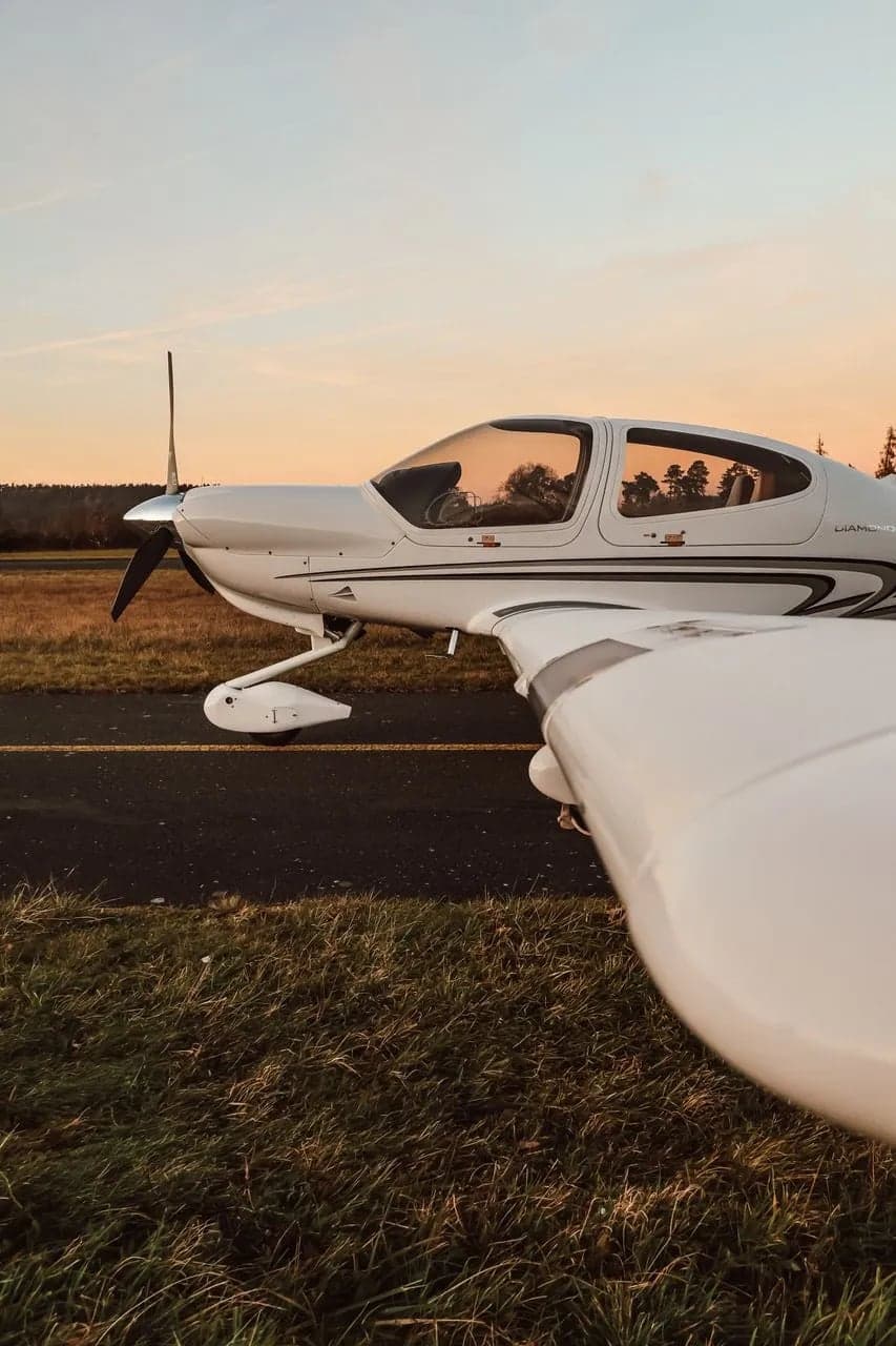 Close up side view of a Diamond DA40 XLS on the runway.