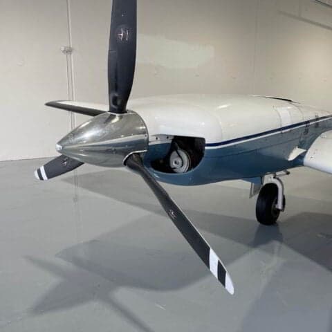 Close-up of the propeller and nose of a Piper PA-31 Navajo.
