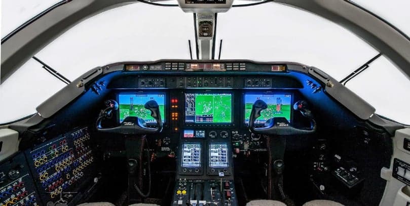 View of the aircraft cockpit with instrument panel and displays.