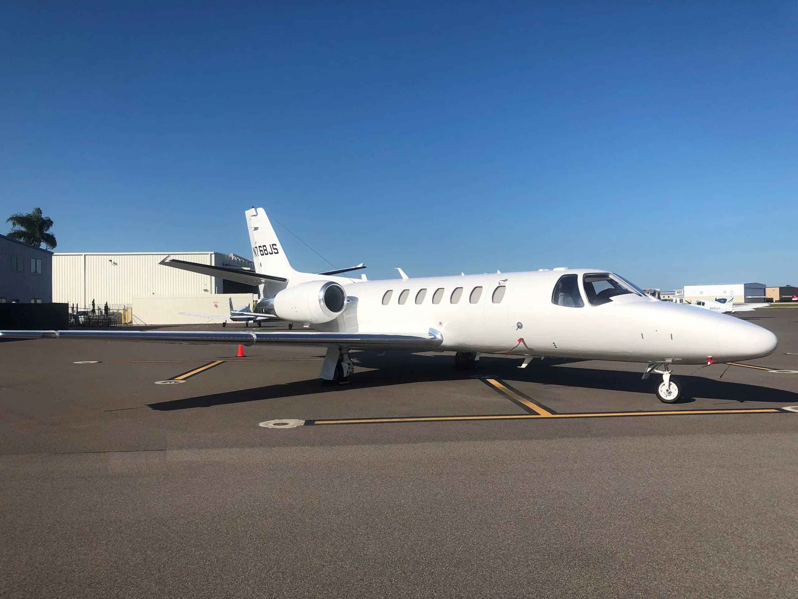 White Cessna Citation CJ3 on the tarmac.