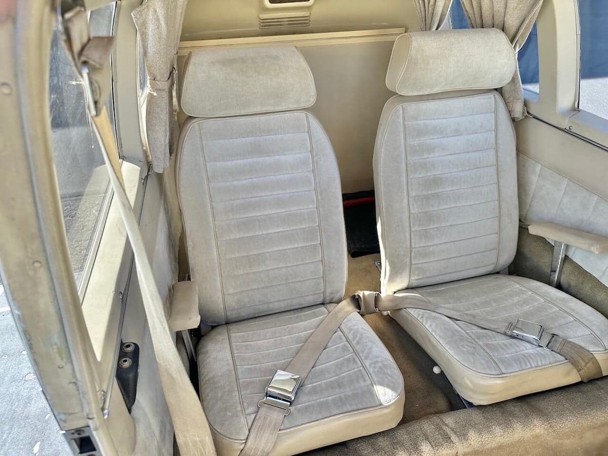 View of the aircraft's front seats with seatbelts.