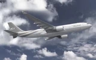 A rendering of an ACJ330 in flight against a cloudy sky.