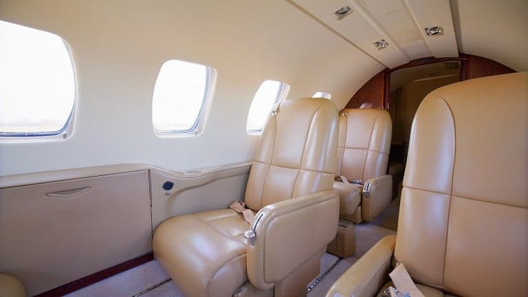 View of the interior cabin with tan leather seats.
