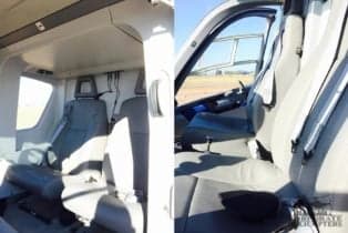 Interior view of the helicopter cabin and cockpit.