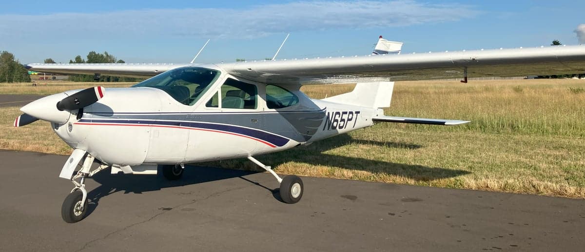 Cessna T206H Turbo Stationair aircraft N65PT parked on the tarmac.