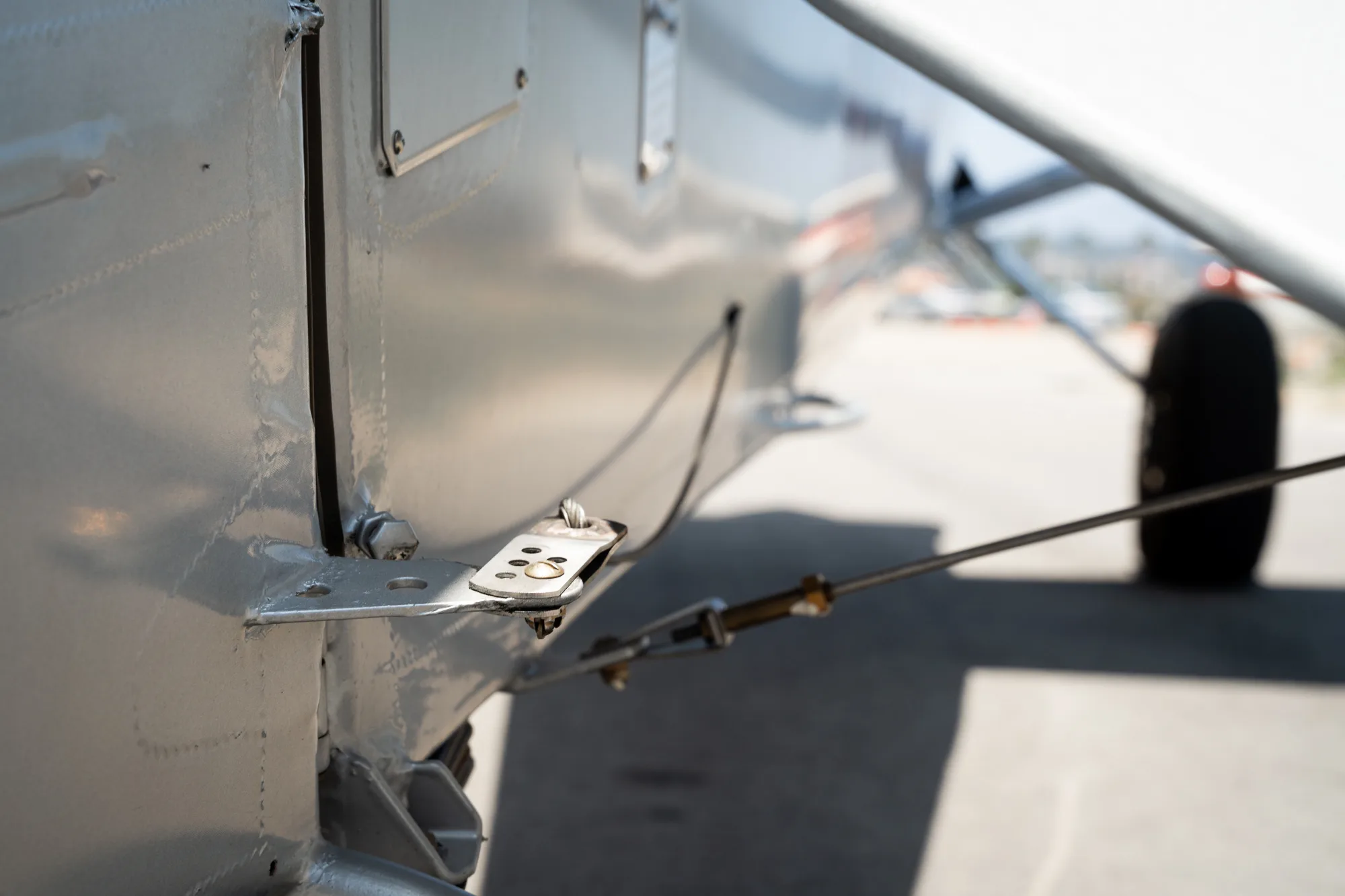 Close up of the exterior details on the side of a CubCrafters XCub aircraft.