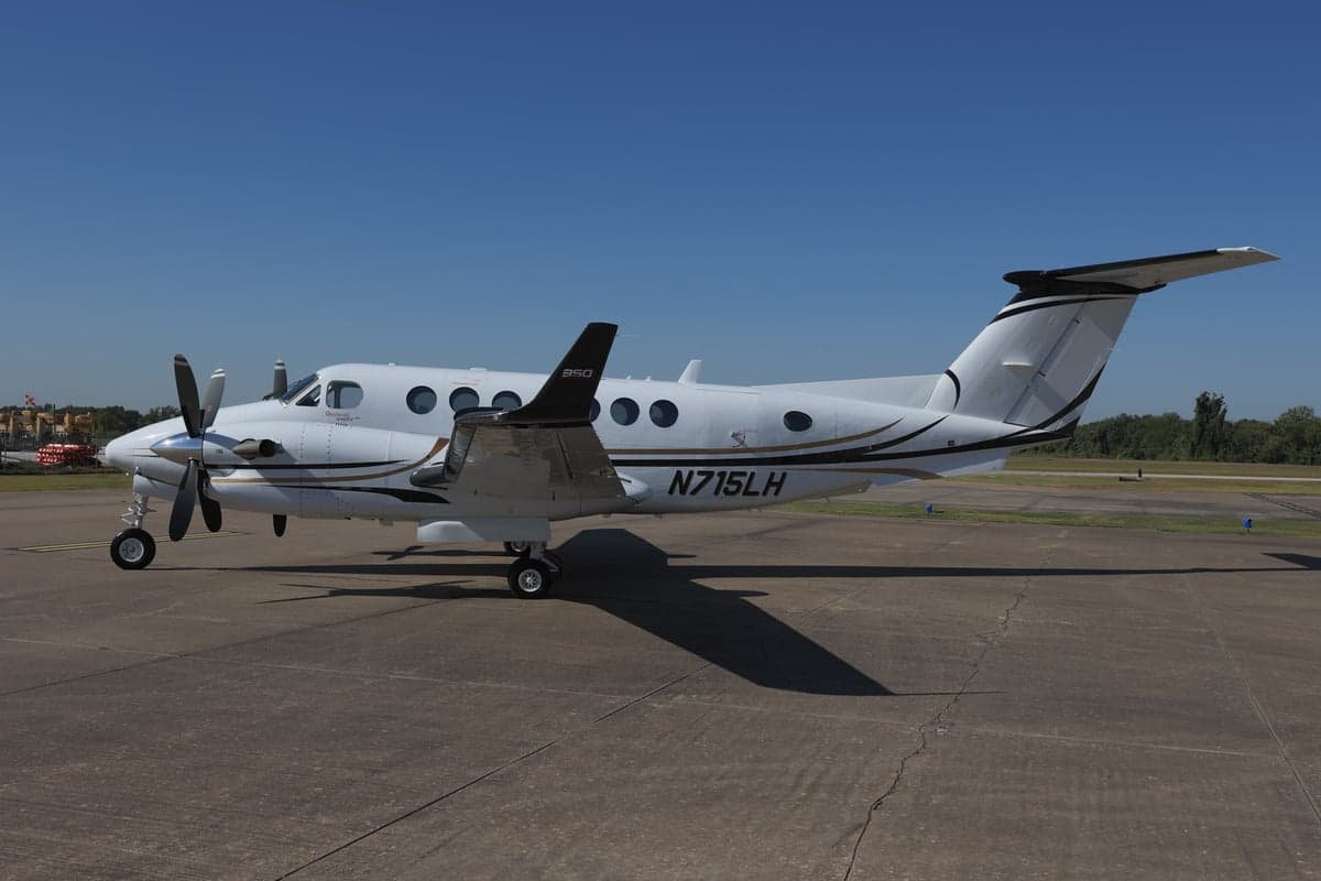 King Air 350 with registration N715LH parked on the tarmac.