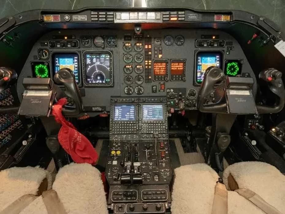 Detailed view of the aircraft cockpit with various instruments and controls.
