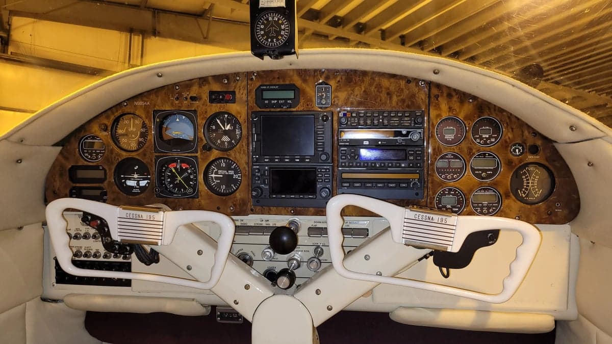 Detailed view of the Cessna 195 instrument panel and controls.