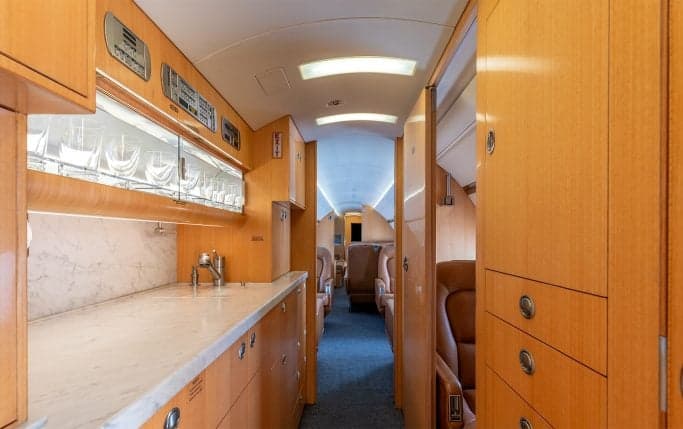 Aircraft cabin interior with leather seats.