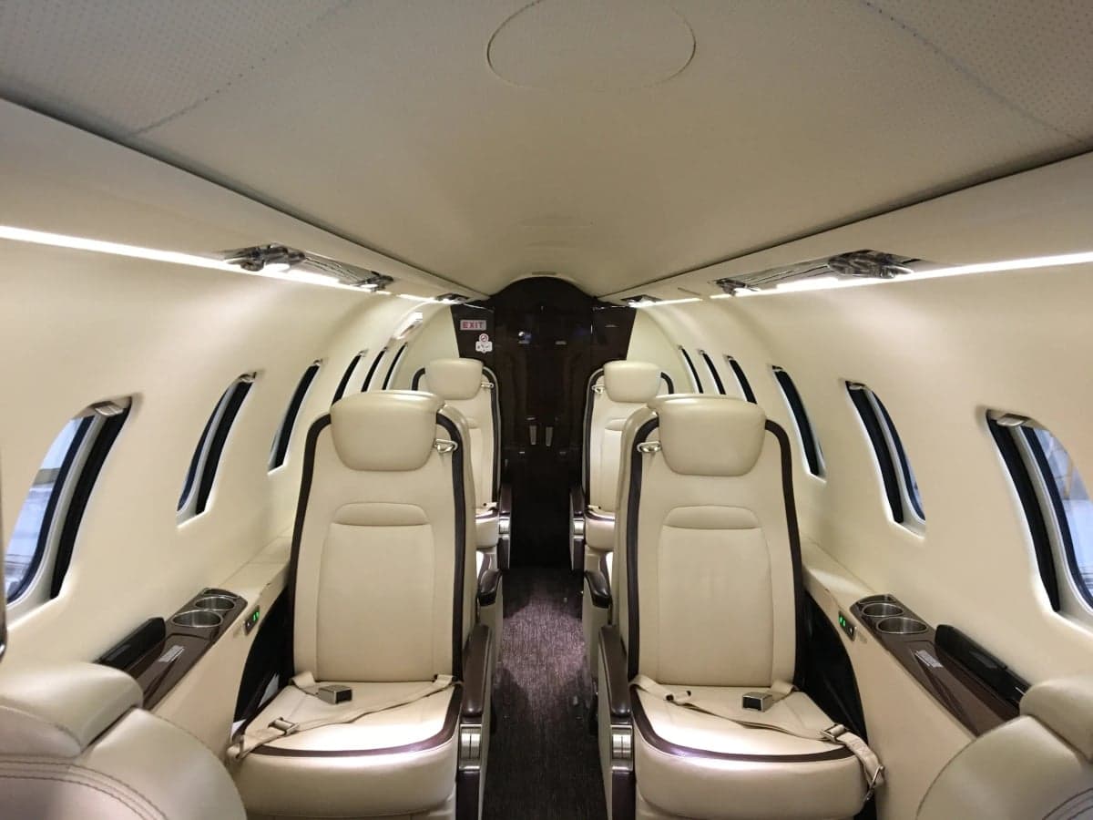 The interior of the aircraft shows the seating arrangement.