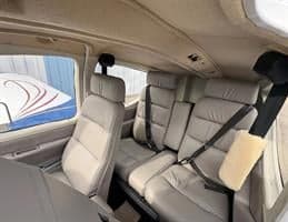 View of the rear seats and interior of the aircraft cabin.