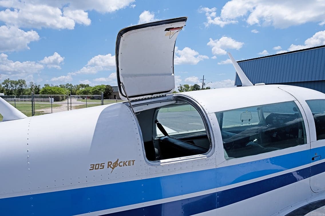 Close up of the aircraft door open, showing the '305 Rocket' logo.