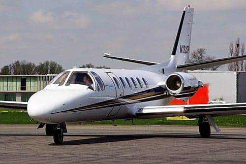 A Cessna Citation CJ1 taxis on the tarmac.