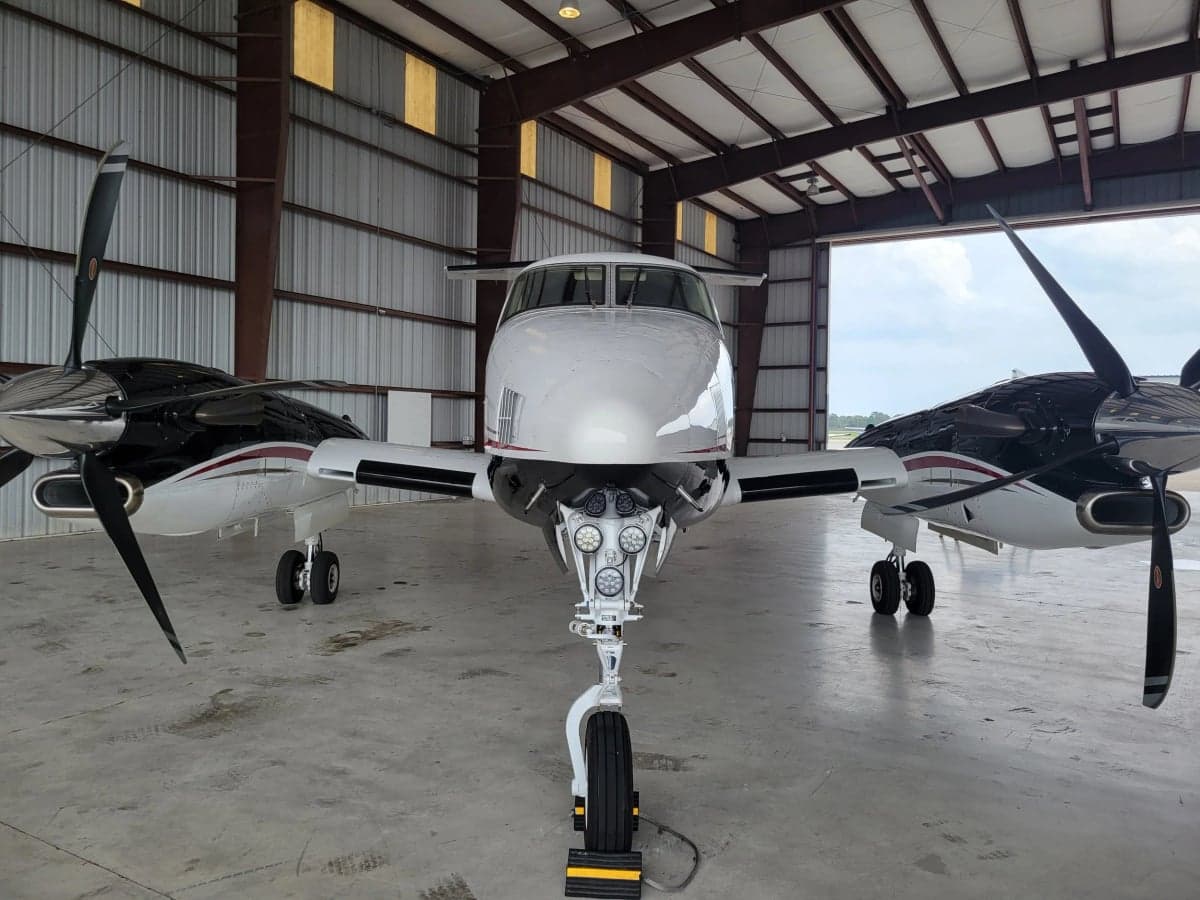 Front view of N494MA King Air in a hangar.