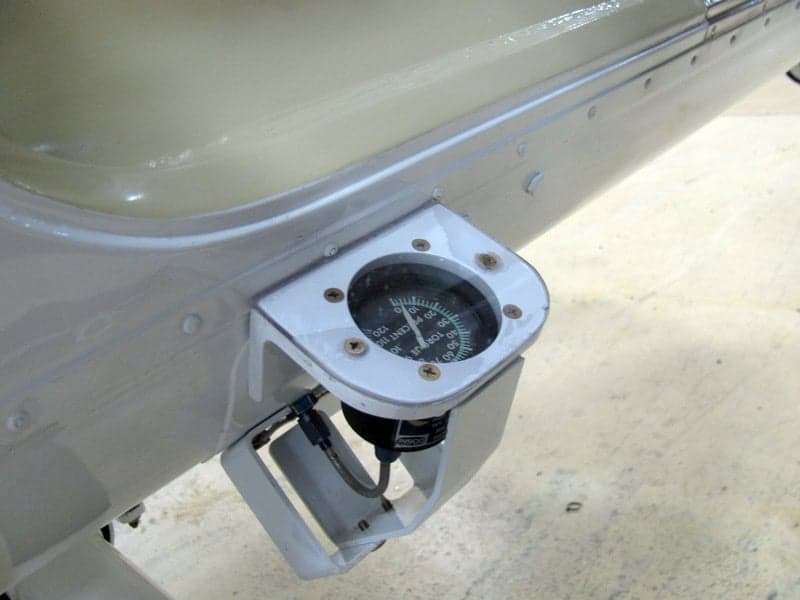 Close-up of an instrument mounted on the exterior of a helicopter.