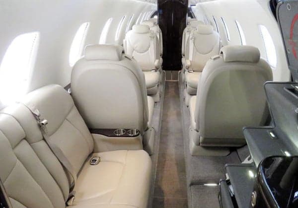 View of the aircraft's interior cabin with leather seats.