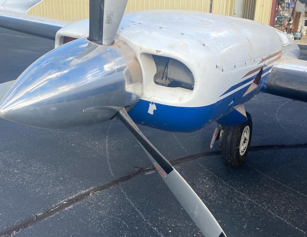 Close-up of the engine nacelle and propeller of the Twin Cessna aircraft.