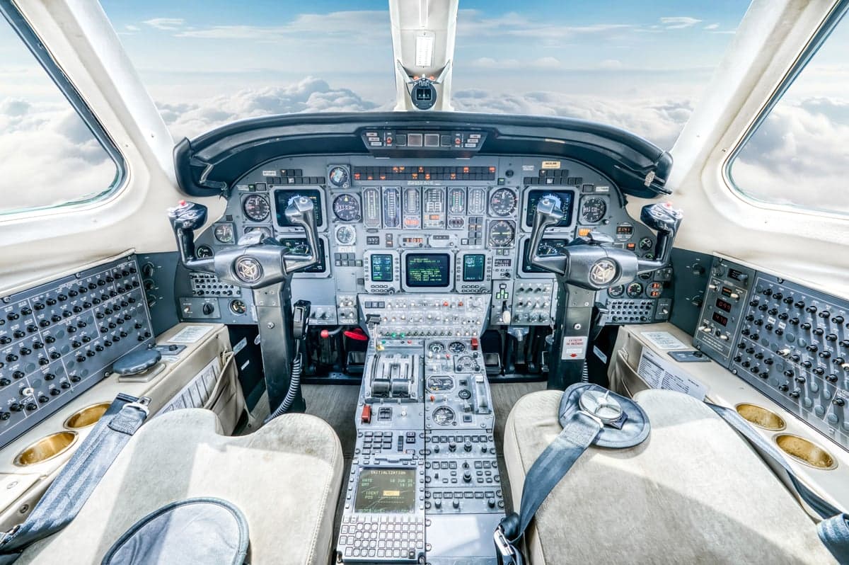 The cockpit of the aircraft features a full instrument panel and two seats.