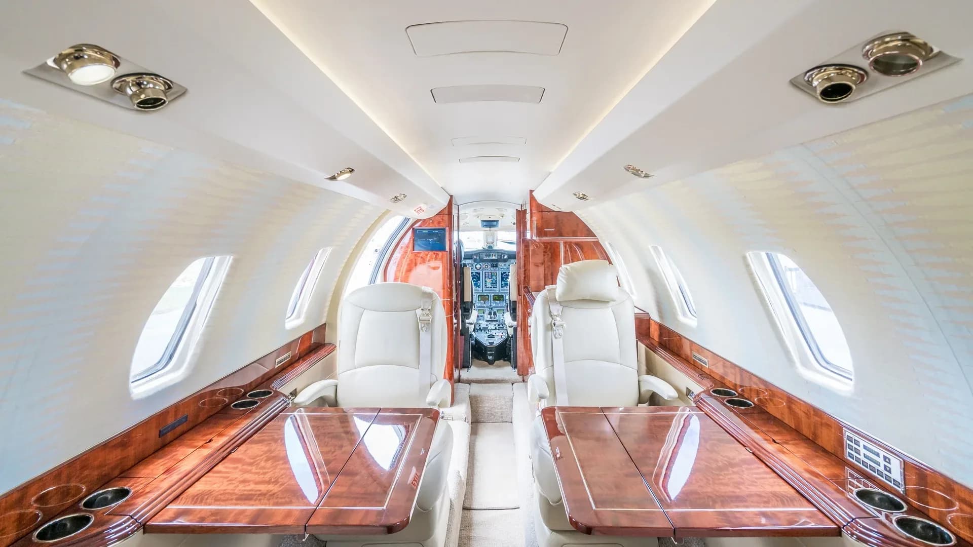 View of the aircraft's interior cabin looking towards the cockpit.