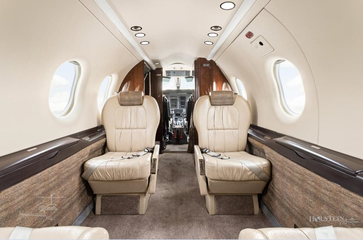 Forward view of the Pilatus PC-12 cabin with leather seats.