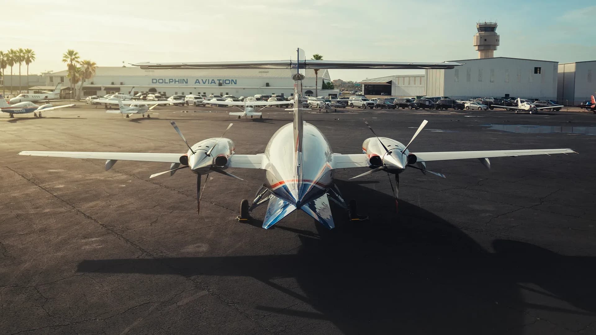 The rear view of a Piaggio Avanti EVO aircraft parked at Dolphin Aviation.