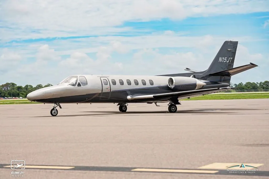 A side view of the N15JT Cessna Citation X business jet on an airfield.