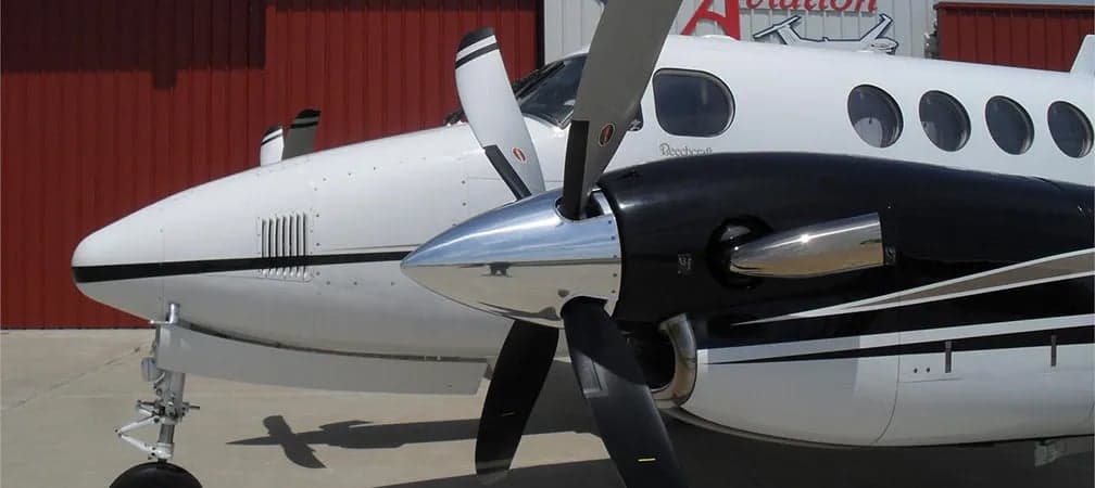 Close up of a King Air propeller and nose.