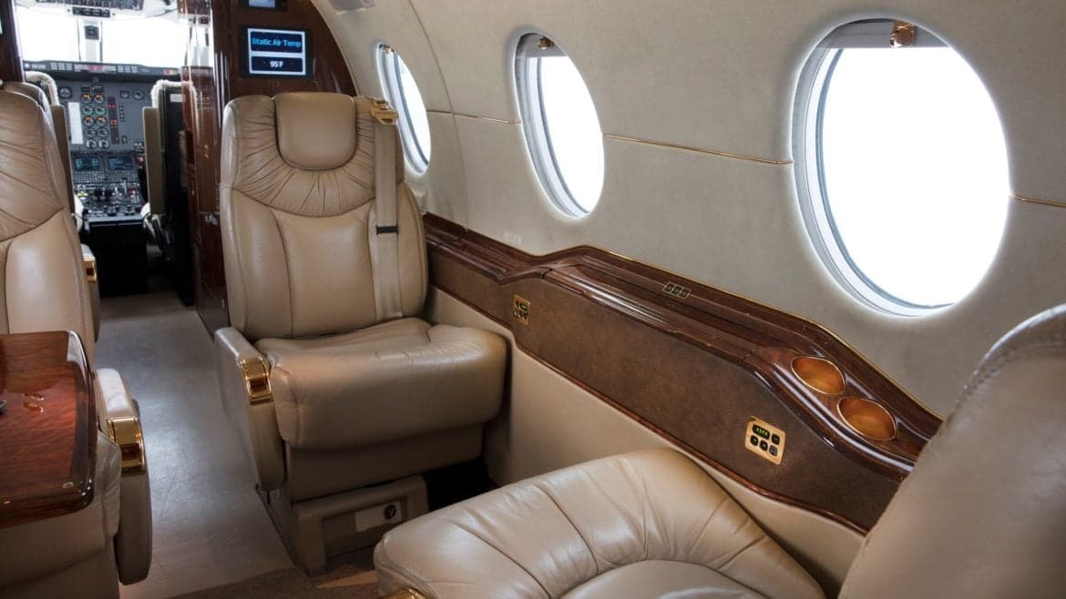 View of the aircraft's interior, showing the seating arrangement and side panel.