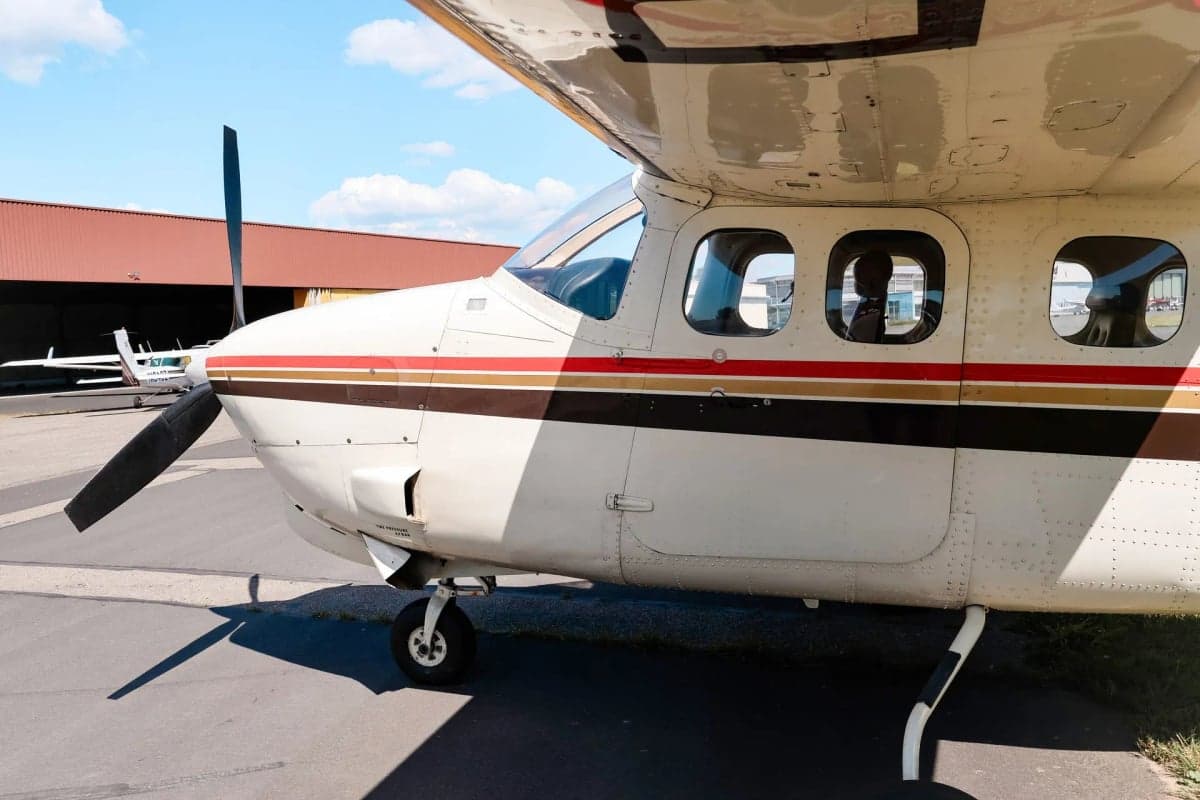 D-EKAD Cessna parked on the tarmac in front of a hangar.