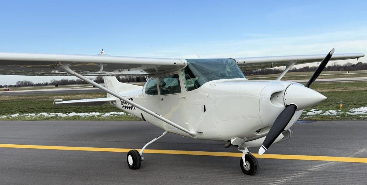 Front view of a Cessna 172 aircraft with tail number N5533R parked on the tarmac.