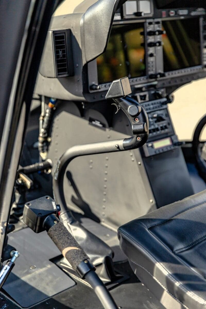 Close-up of the helicopter's instrument panel and controls.