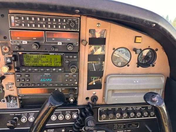 Close-up of the aircraft's radio and navigation equipment in the cockpit.