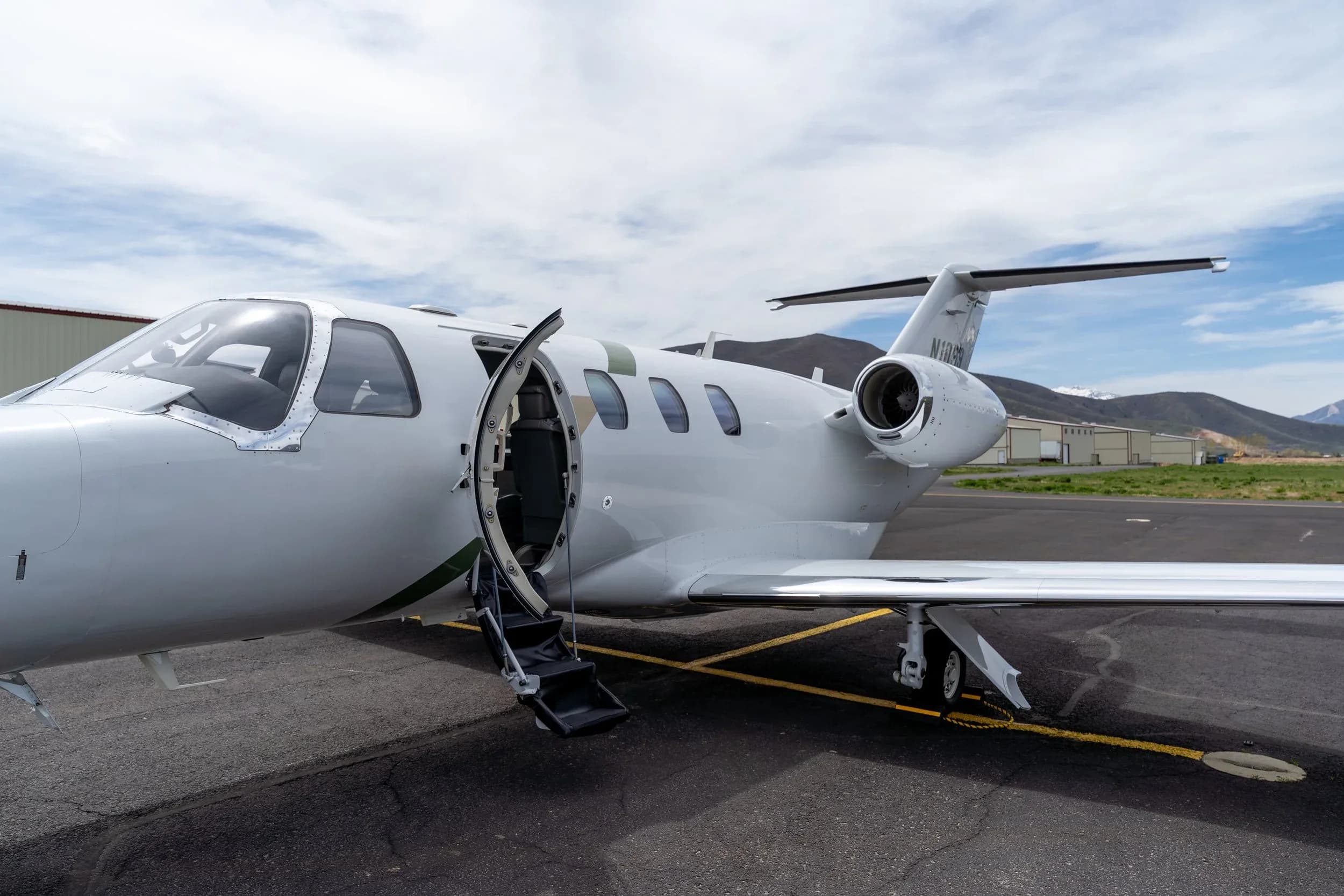 Cessna Citation CJ3+ aircraft N1099 with the entry door open.