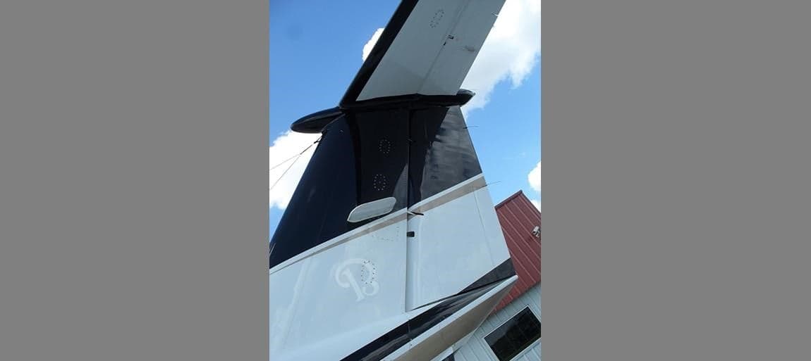 Tail of a King Air aircraft with a black and white paint scheme.