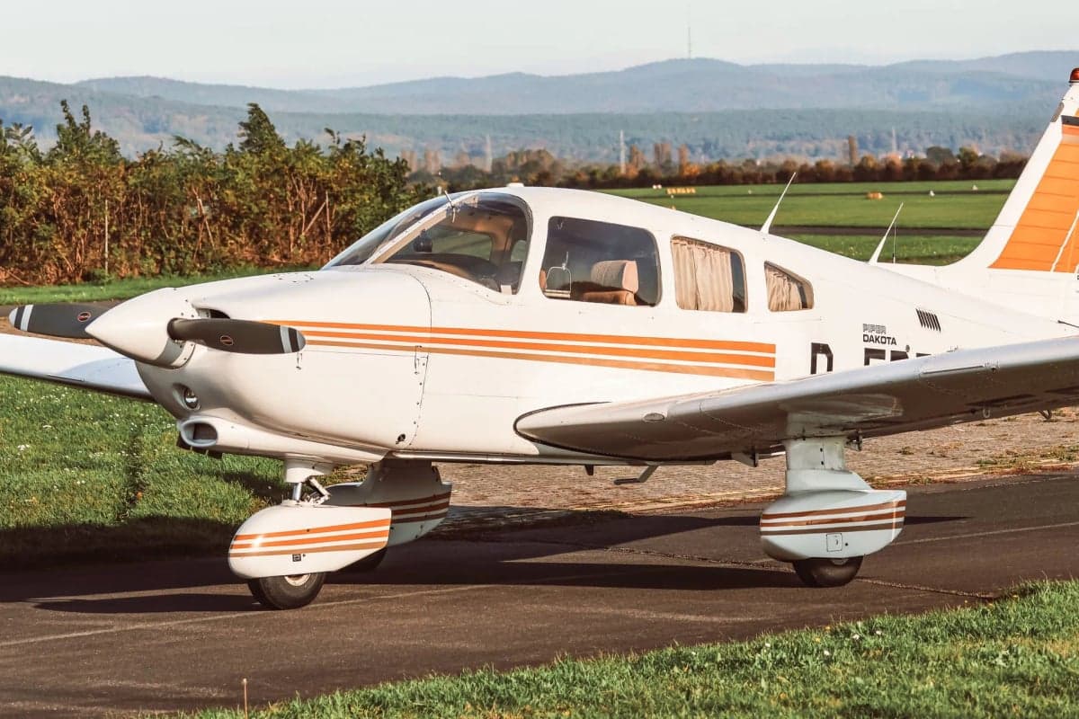 Piper Dakota D-EDBV on the ground with orange stripes.