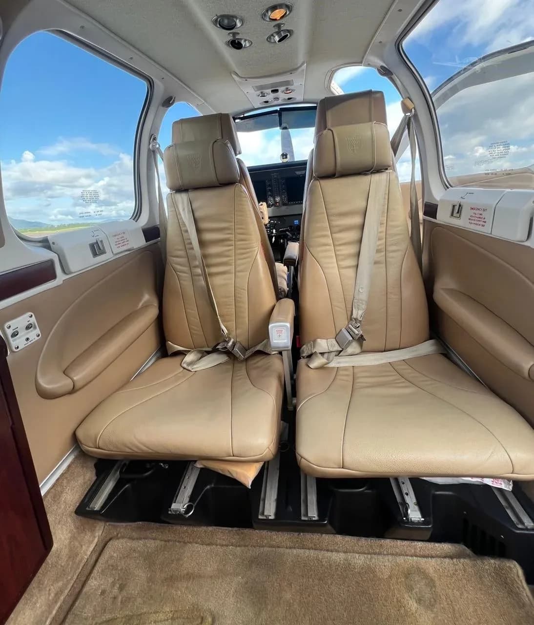 View of the front seats in the cabin of the aircraft.