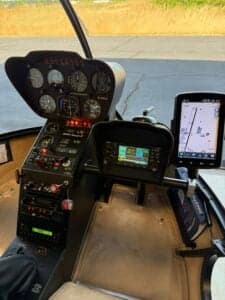 Close-up of the instrument panel and avionics in the cockpit of a helicopter.