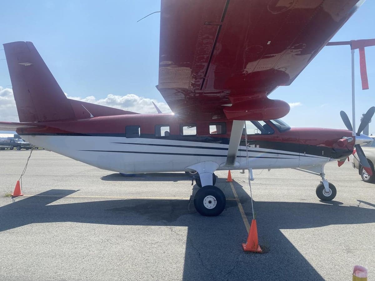 A Quest Kodiak aircraft is shown from the side, parked on the tarmac.