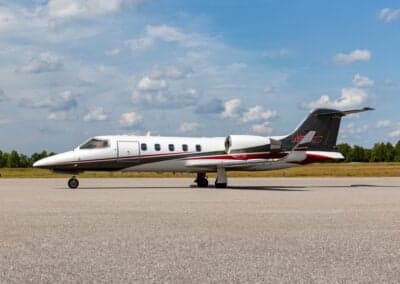 A Learjet 45XR aircraft is parked on the tarmac.