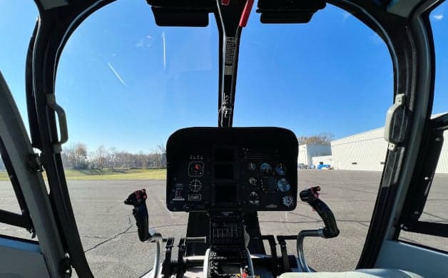 Interior view of the helicopter cabin with seats.