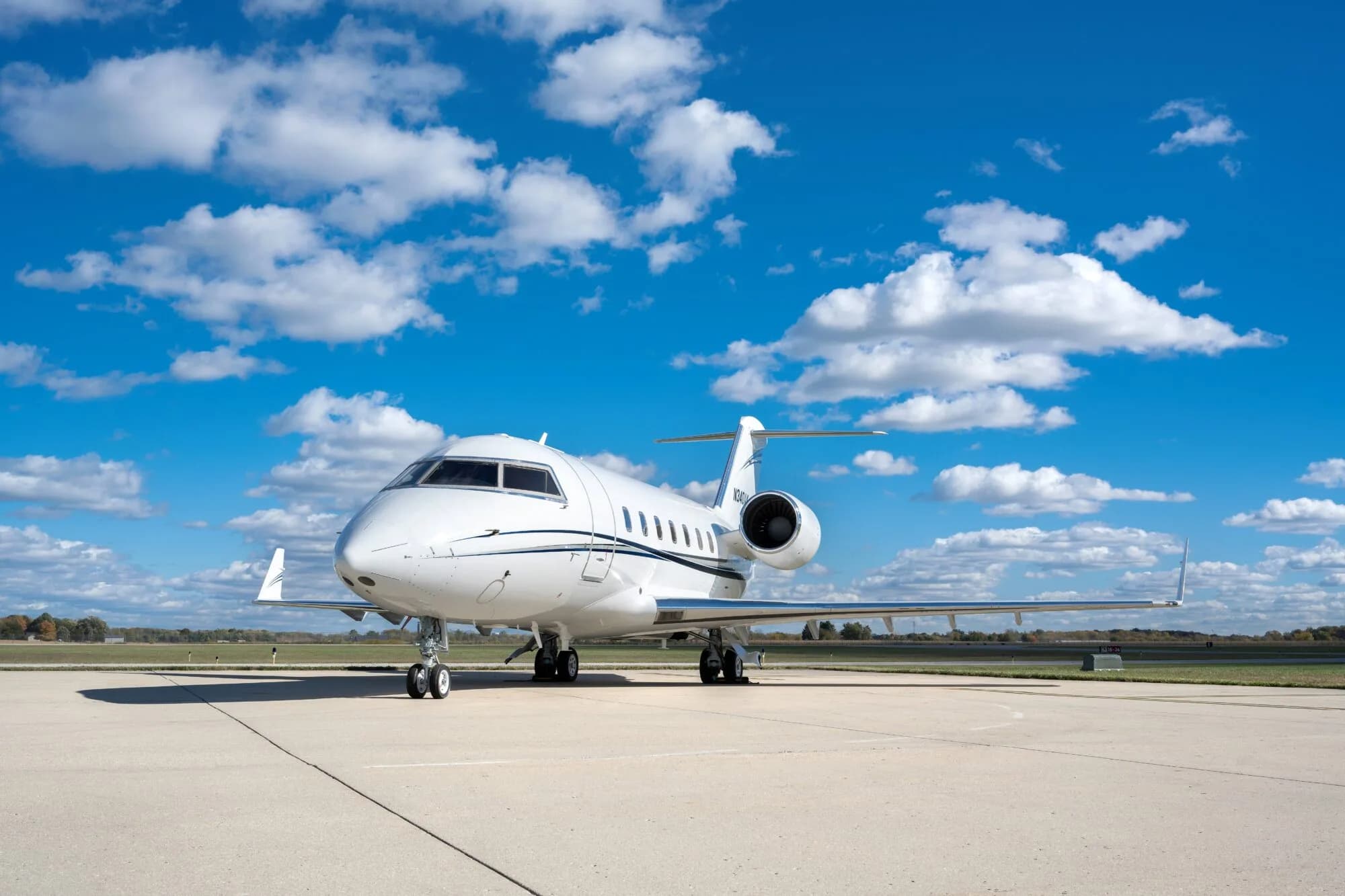 Front view of a white Bombardier Challenger on the tarmac.