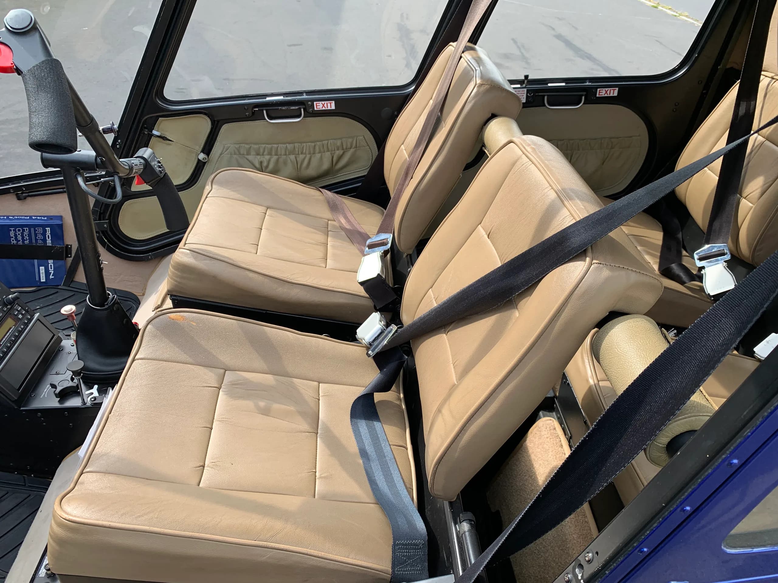 Interior view of the Robinson R44 Raven showing the tan leather seats.