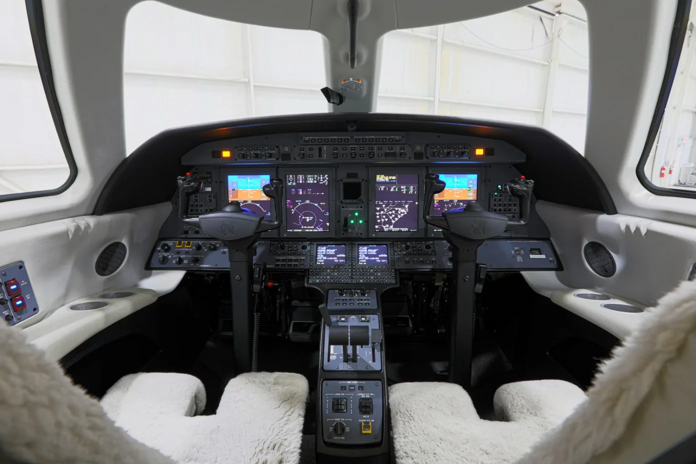 A view of the aircraft's cockpit, showing the instrument panel and controls.