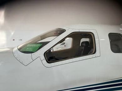 A view of the aircraft's windshield and front windows.