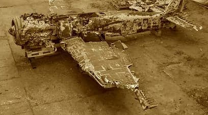 Wrecked aircraft on a pallet.